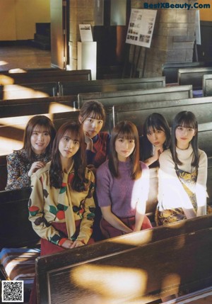 A group of young women standing next to each other.