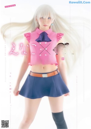 A woman in a pink top and blue skirt posing for a picture.