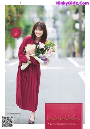 A magazine with a picture of a woman in a yellow dress.